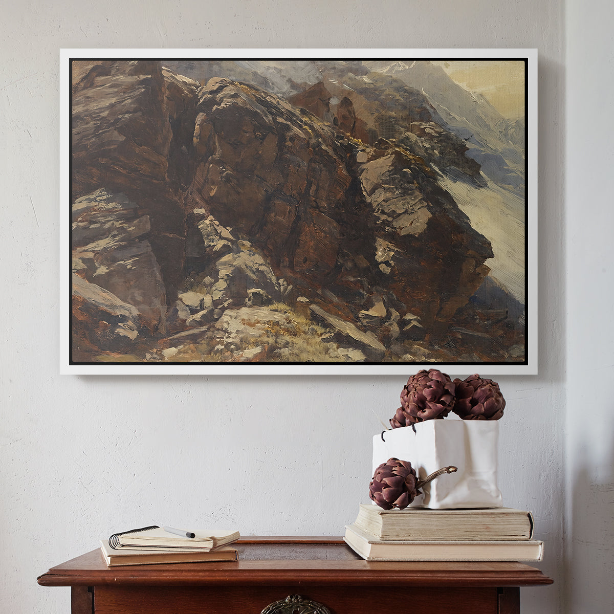 White floater framed canvas featuring High Mountain Study, c. 1870 by Edward Theodore Compton above an entryway table in a minimalist foyer.