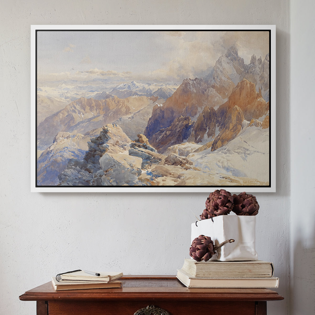 White floater framed canvas featuring Col du Géant, 1903 by Edward Theodore Compton above an entryway table in a minimalist foyer.