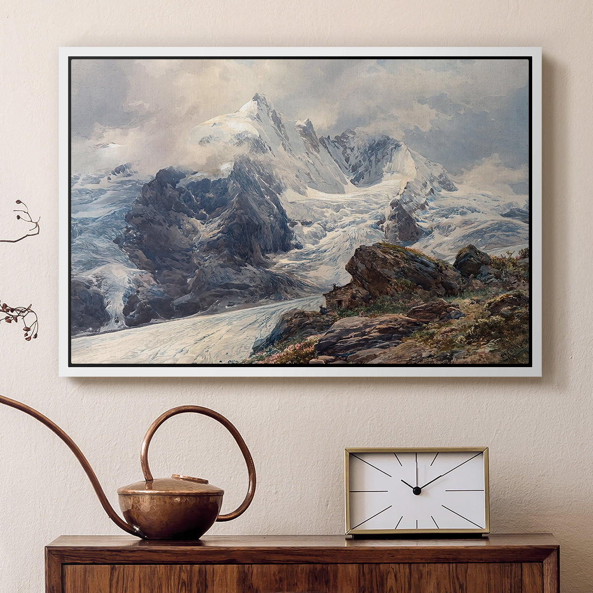 White floater framed canvas featuring a realistic landscape of high mountain under open sky, displayed above a cabinet in a soft-toned living room.