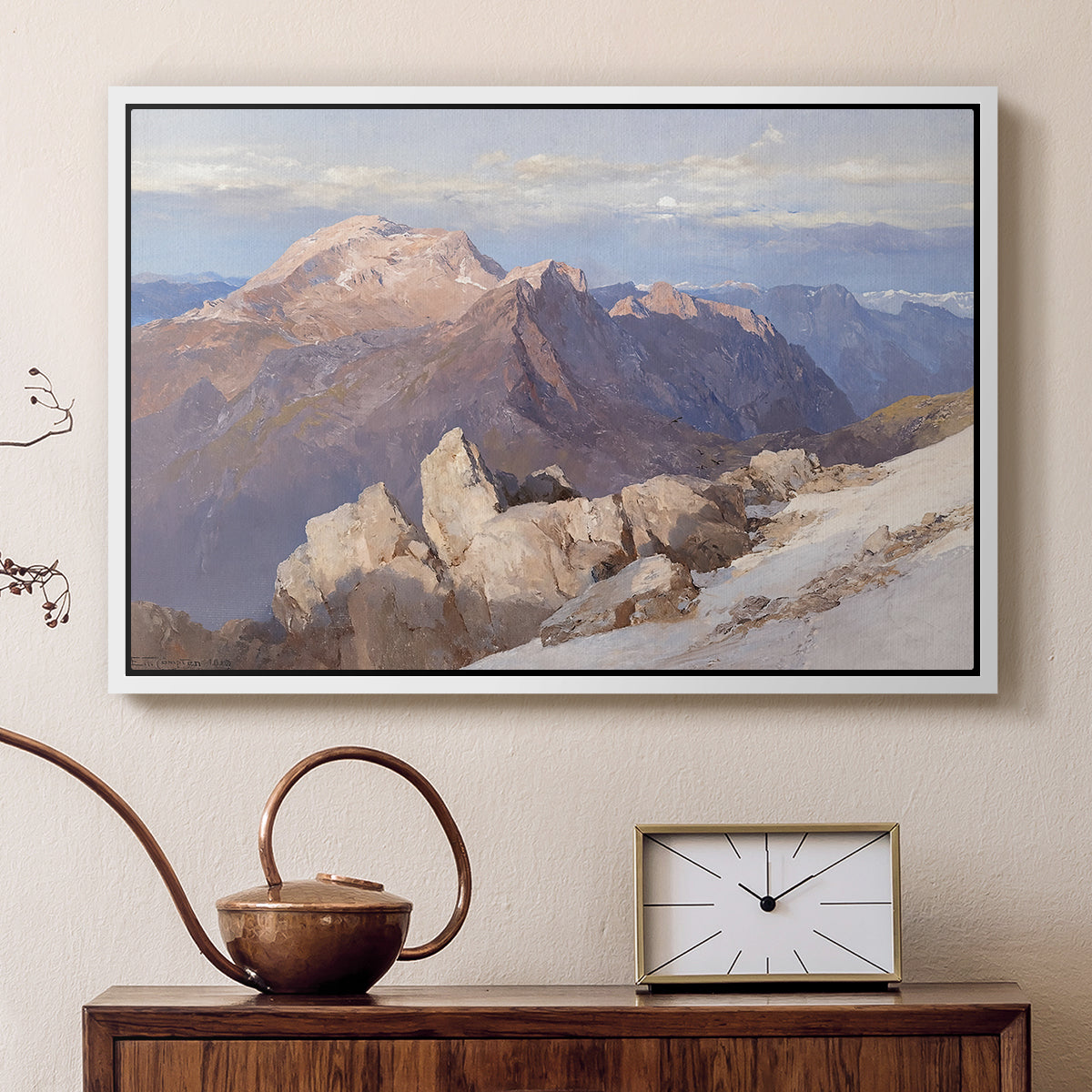 White floater framed canvas featuring a high vantage point overlooking rugged mountain terrain, displayed above a cabinet in a soft-toned living room.