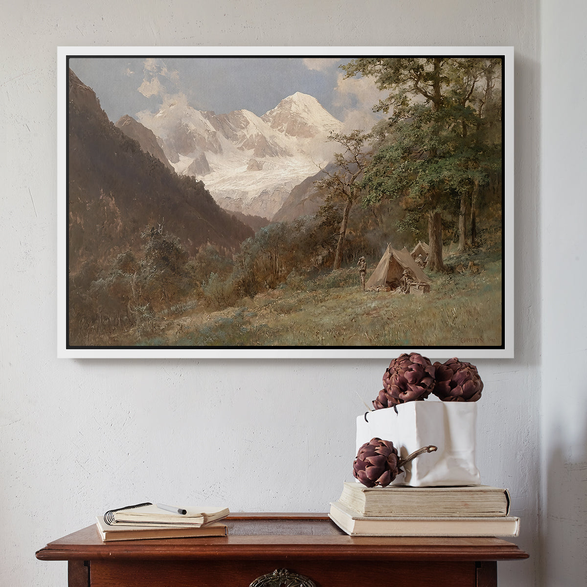 White floater framed canvas featuring Landscape in the Caucasus, c. 1921 by Edward Theodore Compton above an entryway table in a minimalist foyer.