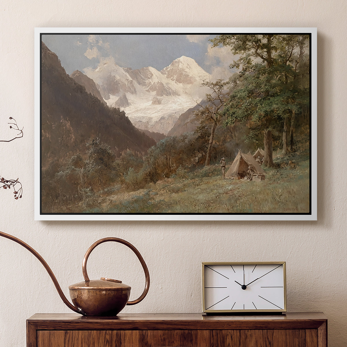 White floater framed canvas featuring a natural scene with valleys and rocky formations, displayed above a cabinet in a soft-toned living room.