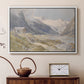 White floater framed canvas featuring a rural alpine setting with shepherds and open terrain, displayed above a cabinet in a soft-toned living room.