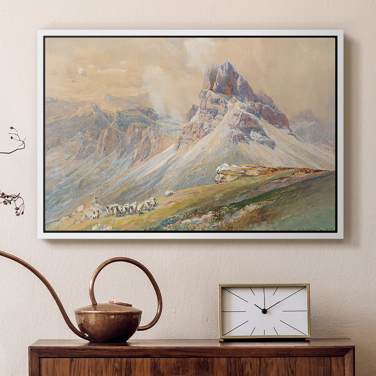 White floater framed canvas featuring an expansive landscape featuring iconic Dolomite peaks, displayed above a cabinet in a soft-toned living room.