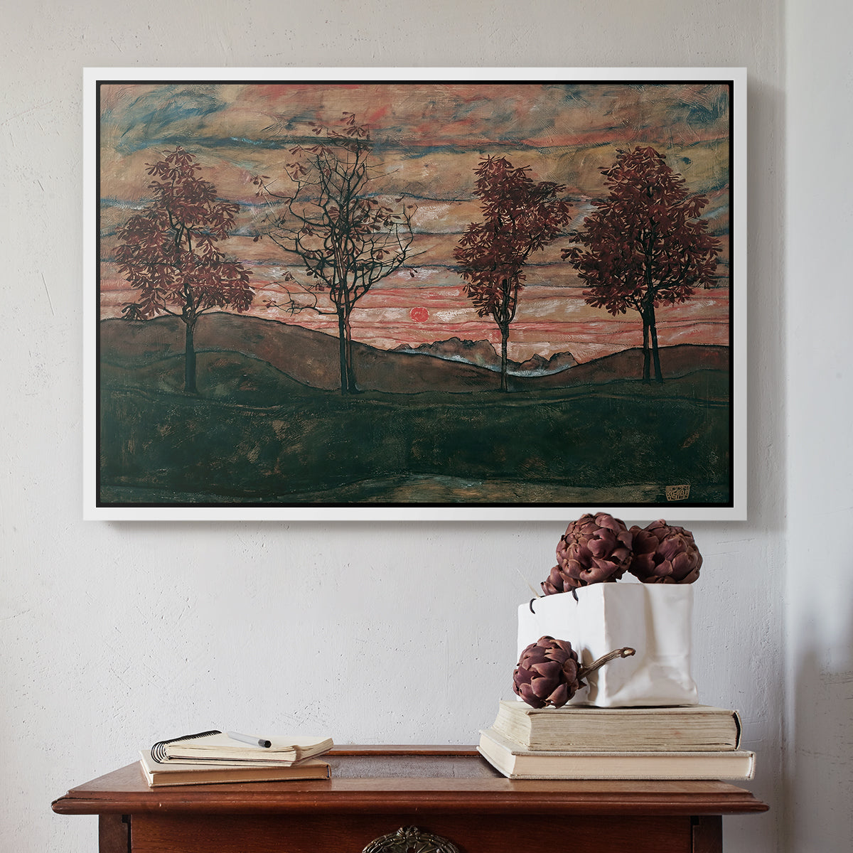 White floater framed canvas featuring Four Trees, 1917 by Egon Schiele above an entryway table in a minimalist foyer.