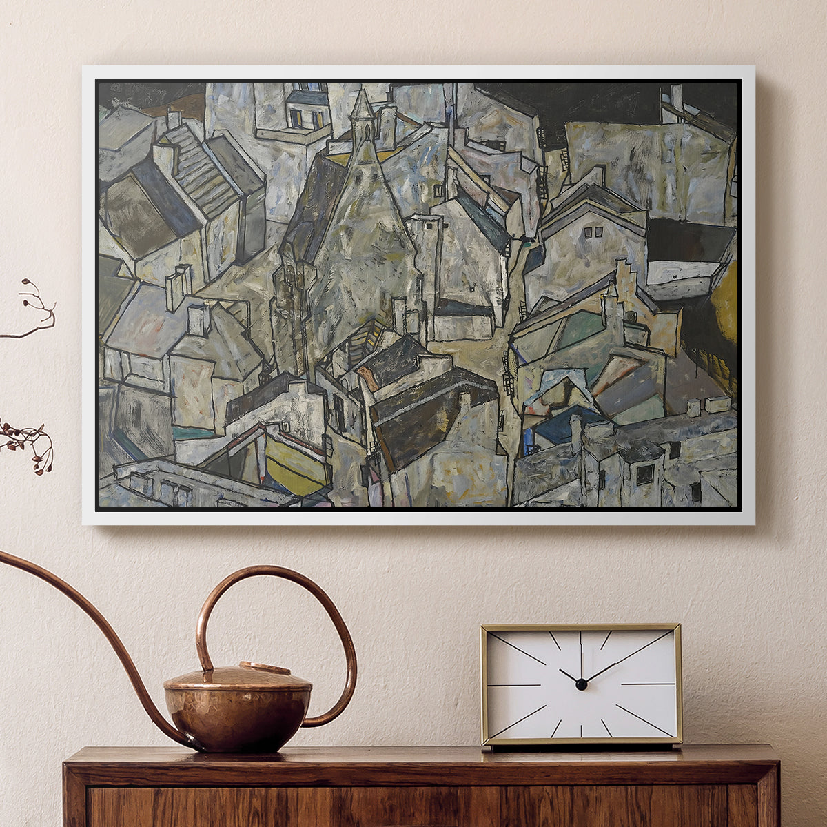 White floater framed canvas featuring an abstracted town view with angular rooftops and fragmented forms, displayed above a cabinet in a soft-toned living room.