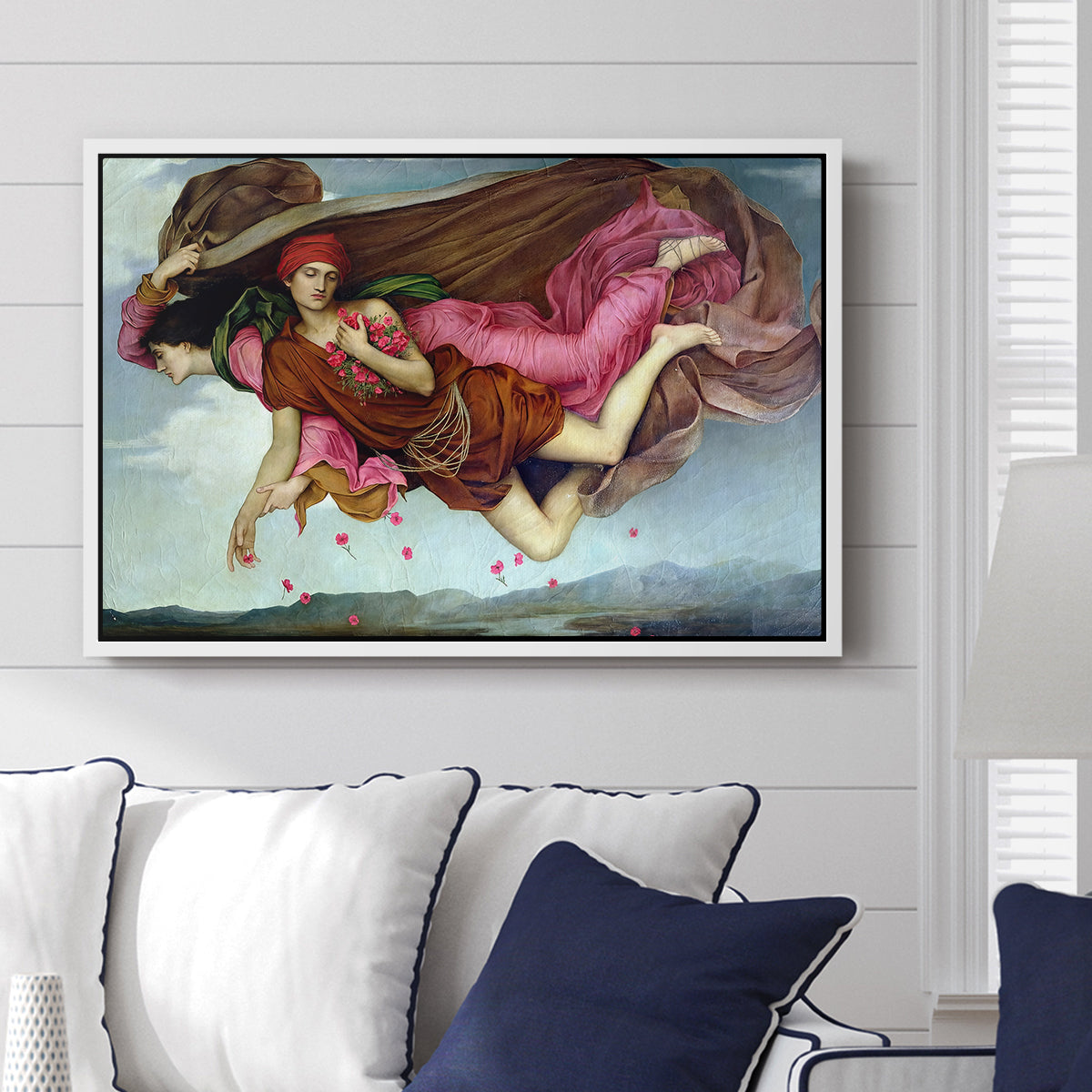 Night and Sleep, 1878 by Evelyn De Morgan displayed above a sofa in a living room in a white floater frame, featuring a symbolic depiction of night and sleep as ethereal figures in motion.