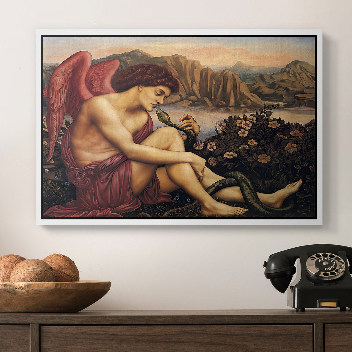 The Angel with the Serpent, c. 1870-1875 by Evelyn De Morgan in a white floater framed canvas displayed above a console table in a hallway, featuring a symbolic imagery of purity overcoming evil forces.