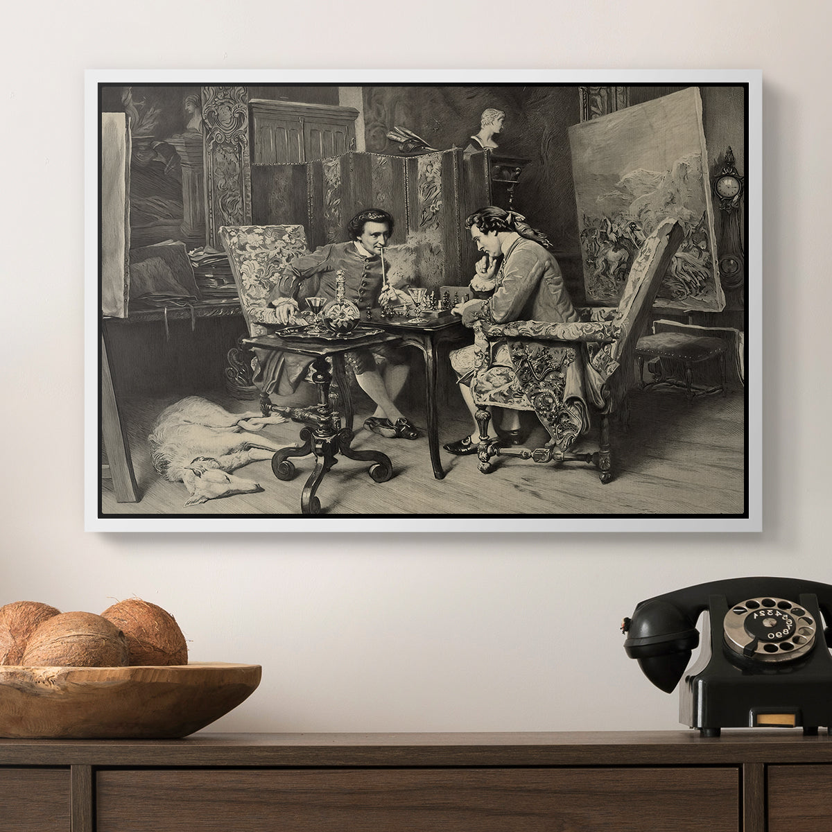 The Chess Players, 1858 by Ernest Meissonier in a white floater framed canvas displayed above a console table in a hallway, featuring a monochrome-style depiction of strategic game between two figures.
