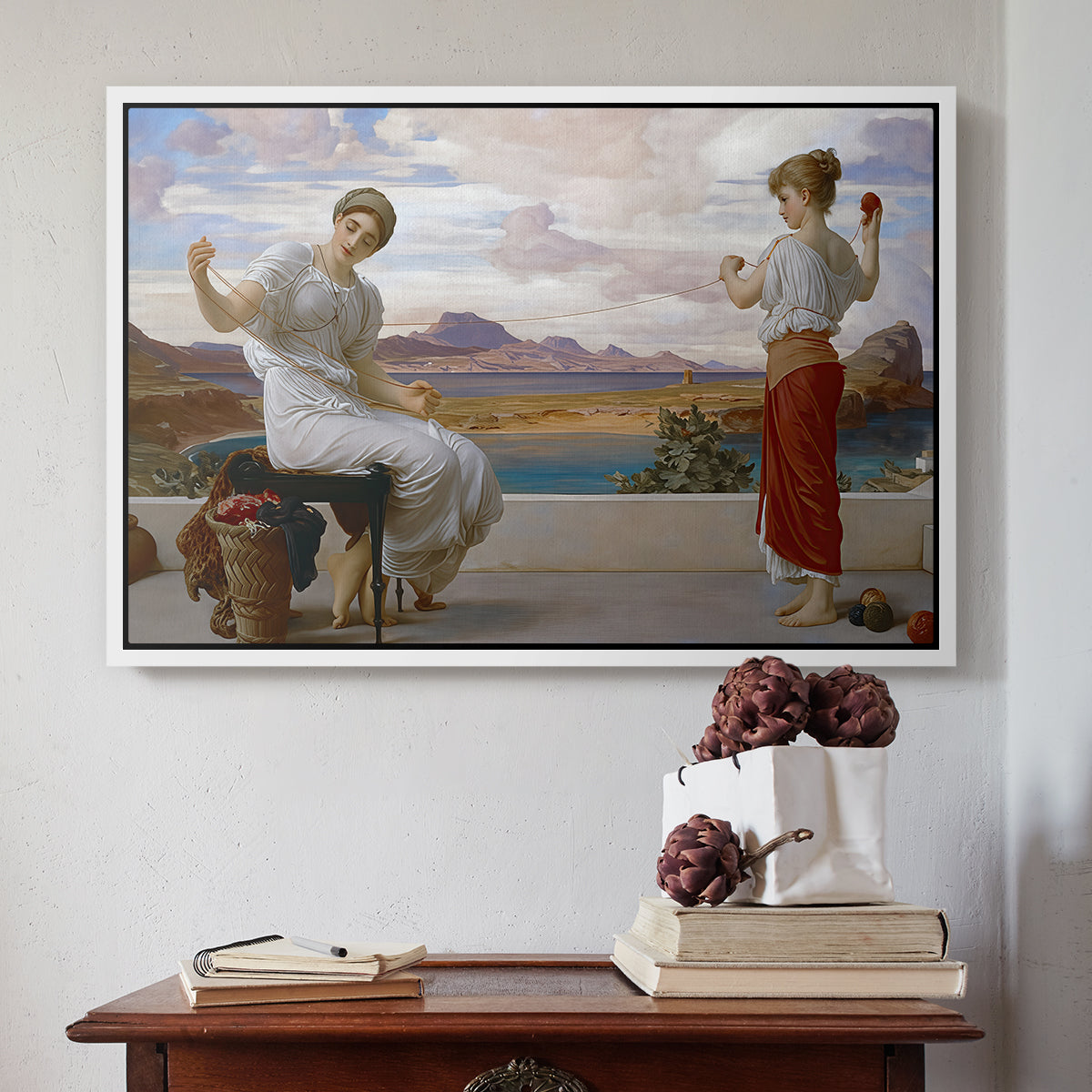 White floater framed canvas featuring Winding the Skein, c. 1878 by Frederic Leighton above an entryway table in a minimalist foyer.