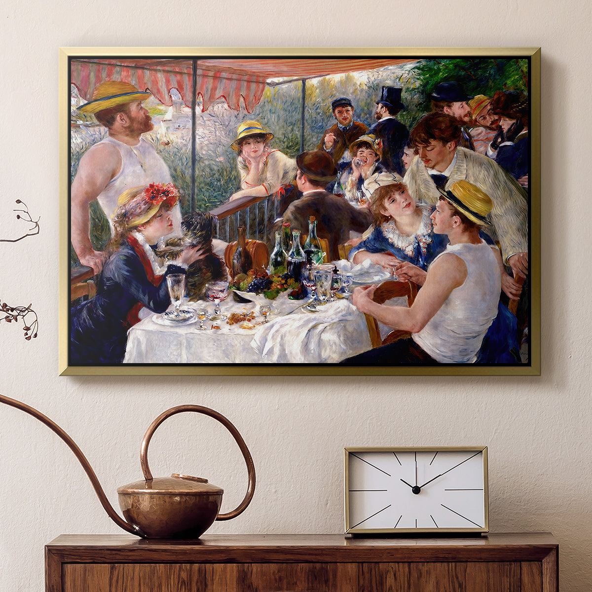 Gold floater framed canvas featuring an impressionist scene of friends enjoying lunch with wine and conversation, displayed above a cabinet in a soft-toned living room.