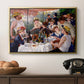 Luncheon of the Boating Party (Le Déjeuner des canotiers), 1880-1881 by Pierre-Auguste Renoir in a gold floater framed canvas displayed above a console table in a hallway, featuring a social dining scene with figures seated around table on riverside terrace.