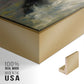 Close-up of the gold floater frame corner and gallery wrapped canvas construction.