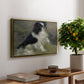 Tama, the Japanese Dog, c. 1876 by Pierre-Auguste Renoir, presented in a gold floater framed canvas featuring a small black and white dog standing in shallow water with soft brushstrokes, displayed above a hallway console table.