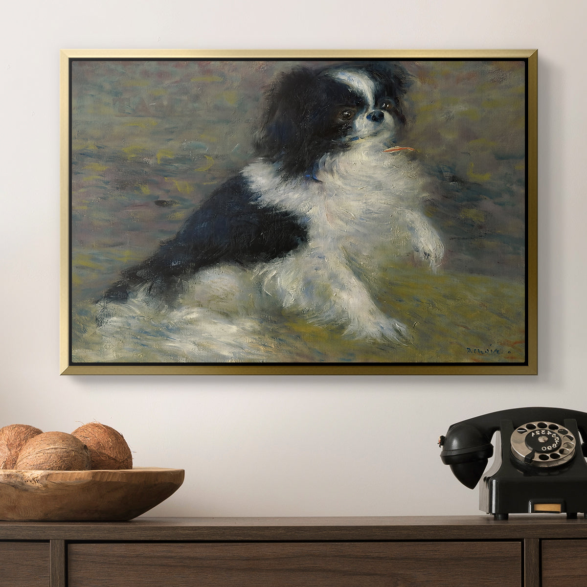 Tama, the Japanese Dog, c. 1876 by Pierre-Auguste Renoir in a gold floater framed canvas displayed above a console table in a hallway, featuring an animal portrait of a dog in natural outdoor setting with soft light.
