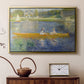 Gold floater framed canvas featuring a couple seated in boat on river surrounded by soft reflections, displayed above a cabinet in a soft-toned living room.