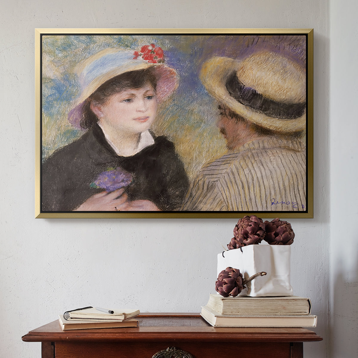 Gold floater framed canvas featuring Boating Couple (Aline Charigot and Renoir), c. 1881 by Pierre-Auguste Renoir above an entryway table in a minimalist foyer.