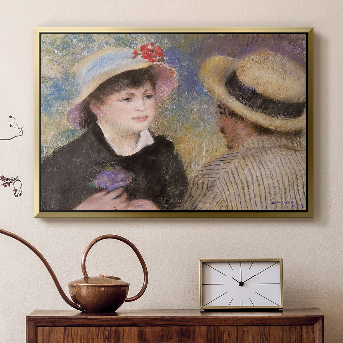 Gold floater framed canvas featuring an impressionist depiction of couple enjoying leisure time near water, displayed above a cabinet in a soft-toned living room.