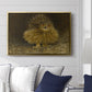 An Eagle Owl (Berguv), 1905 by Bruno Liljefors displayed above a sofa in a living room in a gold floater frame, featuring a detailed wildlife painting of eagle owl with piercing eyes in darkness.