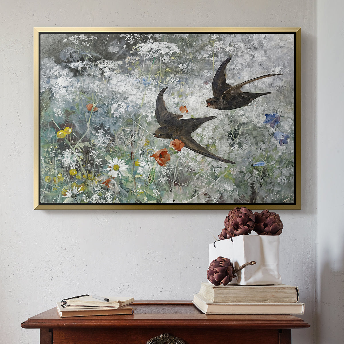 Gold floater framed canvas featuring Common Swifts, 1886 by Bruno Liljefors above an entryway table in a minimalist foyer.