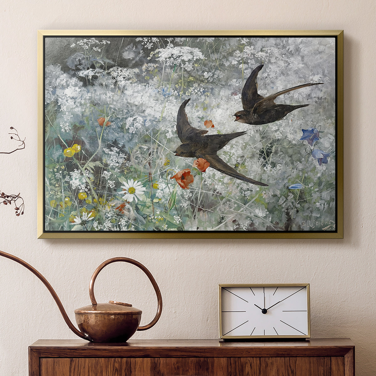 Gold floater framed canvas featuring a multiple birds flying together in natural outdoor scene, displayed above a cabinet in a soft-toned living room.