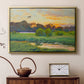 Gold floater framed canvas featuring a wild duck gliding through a golden sunset sky, displayed above a cabinet in a soft-toned living room.
