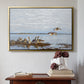 Gold floater framed canvas featuring Greylag Geese (Grågäss), 1922 by Bruno Liljefors above an entryway table in a minimalist foyer.