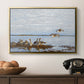 Greylag Geese (Grågäss), 1922 by Bruno Liljefors in a gold floater framed canvas displayed above a console table in a hallway, featuring a flock of geese positioned along marshy terrain.
