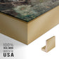 Close-up of the gold floater frame corner and gallery wrapped canvas construction.