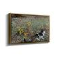 Angled view of Cat on a Flowery Meadow, 1887 by Bruno Liljefors in a gold floater framed canvas.