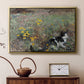 Gold floater framed canvas featuring an animal scene of cat hidden in lush meadow vegetation, displayed above a cabinet in a soft-toned living room.