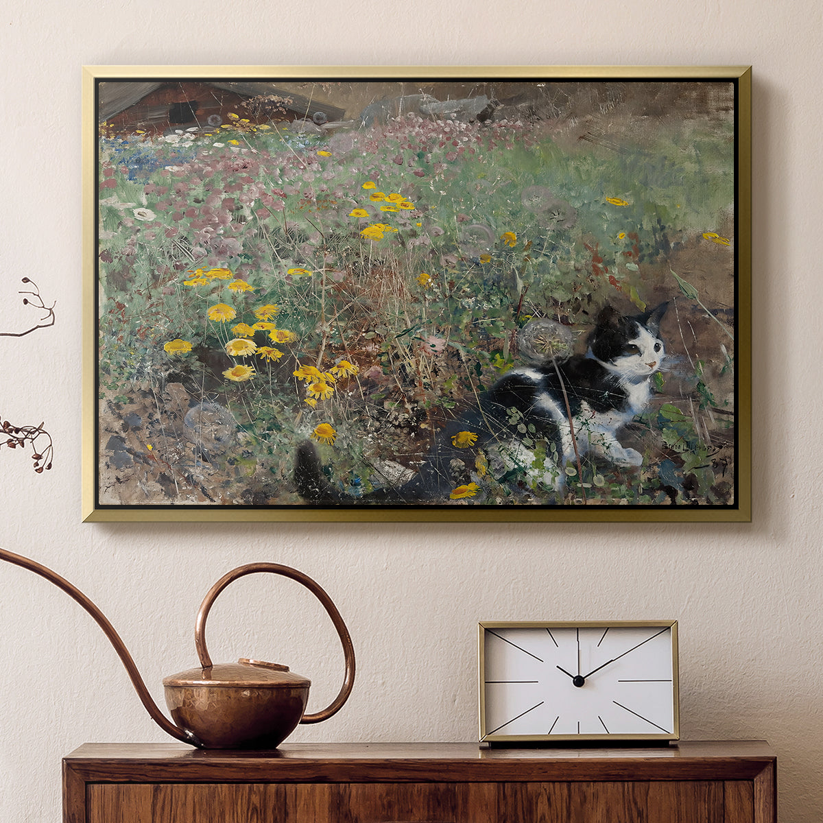 Gold floater framed canvas featuring an animal scene of cat hidden in lush meadow vegetation, displayed above a cabinet in a soft-toned living room.