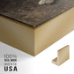 Close-up of the gold floater frame corner and gallery wrapped canvas construction.