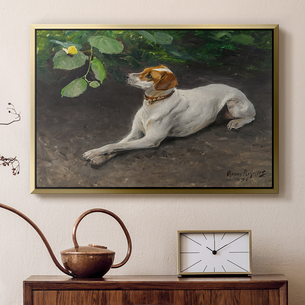 Gold floater framed canvas featuring an animal painting of dog stretched out on earthy terrain, displayed above a cabinet in a soft-toned living room.