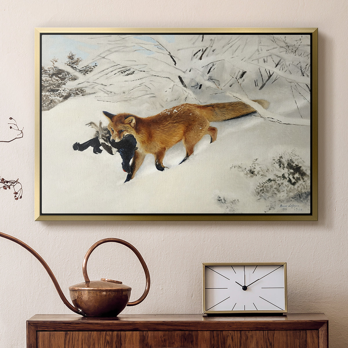 Gold floater framed canvas featuring a red fox crossing snow-covered ground under pale sky, displayed above a cabinet in a soft-toned living room.