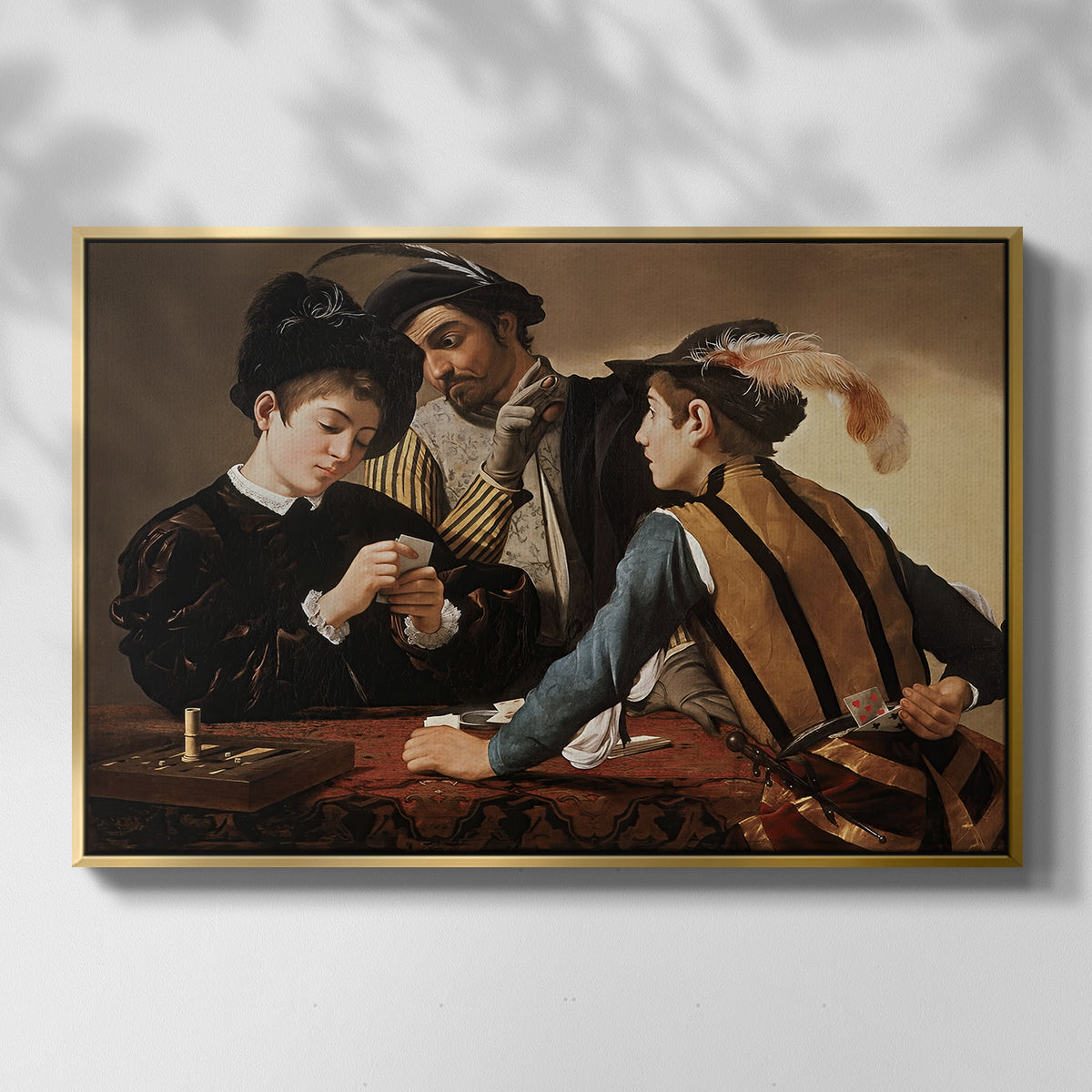 Front view of The Cardsharps, c. 1594 by Caravaggio in a gold floater framed canvas.