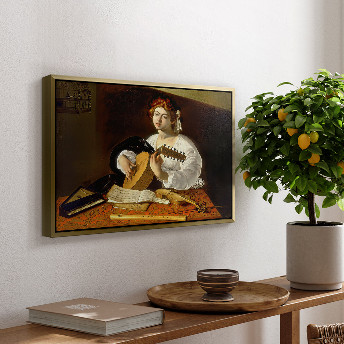 The Lute Player (Wildenstein Version), c. 1596 by Caravaggio, presented in a gold floater framed canvas featuring a young man playing lute surrounded by sheet music and still life objects, displayed above a hallway console table.