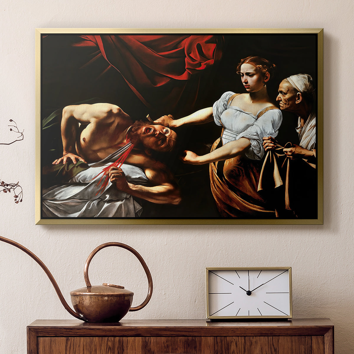 Gold floater framed canvas featuring an intense moment of Judith slaying Holofernes with sword, displayed above a cabinet in a soft-toned living room.