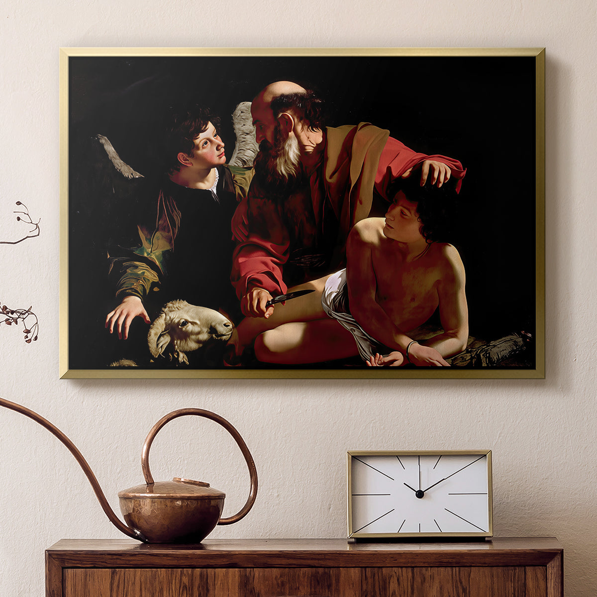 Gold floater framed canvas featuring a dramatic moment of divine intervention during sacrifice of Isaac, displayed above a cabinet in a soft-toned living room.