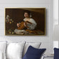 The Lute Player (Hermitage Version), c. 1596 by Caravaggio displayed above a sofa in a living room in a gold floater frame, featuring a portrait of lute player surrounded by still life arrangement.