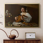 Gold floater framed canvas featuring an intimate musical scene with instrument and decorative objects, displayed above a cabinet in a soft-toned living room.