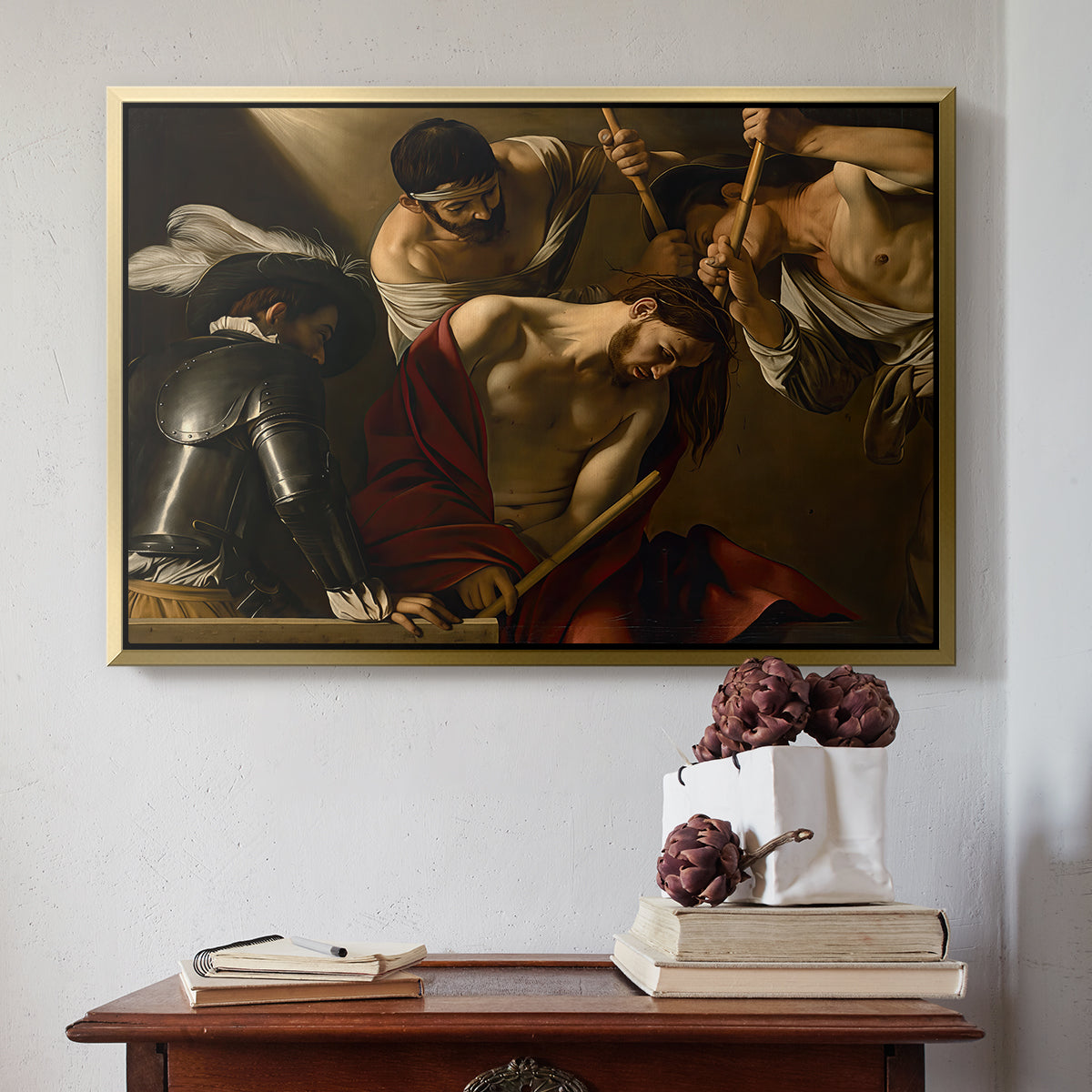 Gold floater framed canvas featuring The Crowning with Thorns (Vienna Version), c. 1602-1604 by Caravaggio above an entryway table in a minimalist foyer.