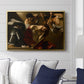 The Crowning with Thorns (Vienna Version), c. 1602-1604 by Caravaggio displayed above a sofa in a living room in a gold floater frame, featuring a biblical scene of Christ being mocked and crowned with thorns.