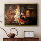 Gold floater framed canvas featuring a peaceful religious moment with figures reclining in natural setting, displayed above a cabinet in a soft-toned living room.