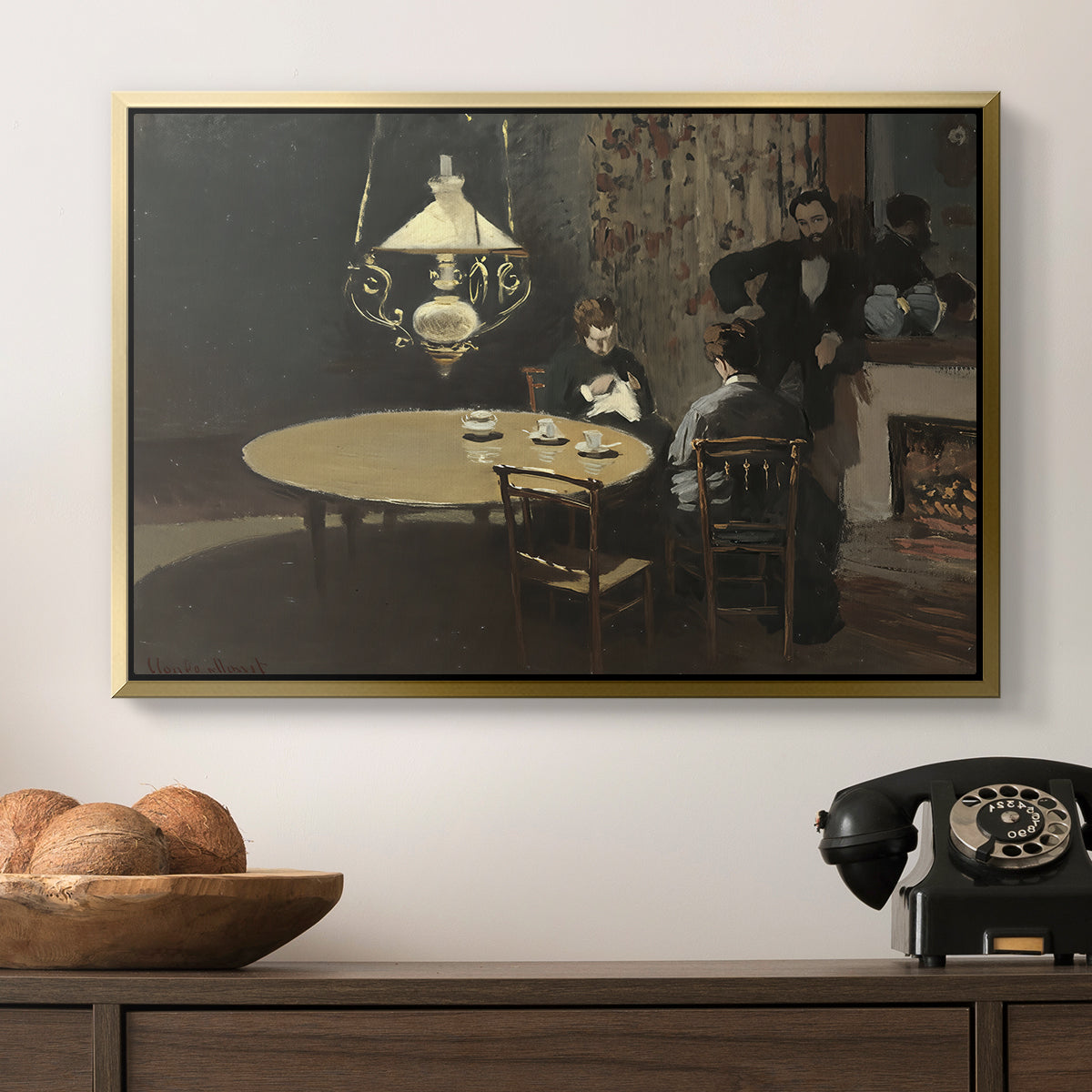 Interior, after Dinner, 1868-1869 by Claude Monet in a gold floater framed canvas displayed above a console table in a hallway, featuring an intimate indoor scene with figure and table in low lighting.