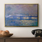 Charing Cross Bridge, 1903 by Claude Monet in a gold floater framed canvas displayed above a console table in a hallway, featuring a city bridge scene softened by mist and impressionist brushwork.
