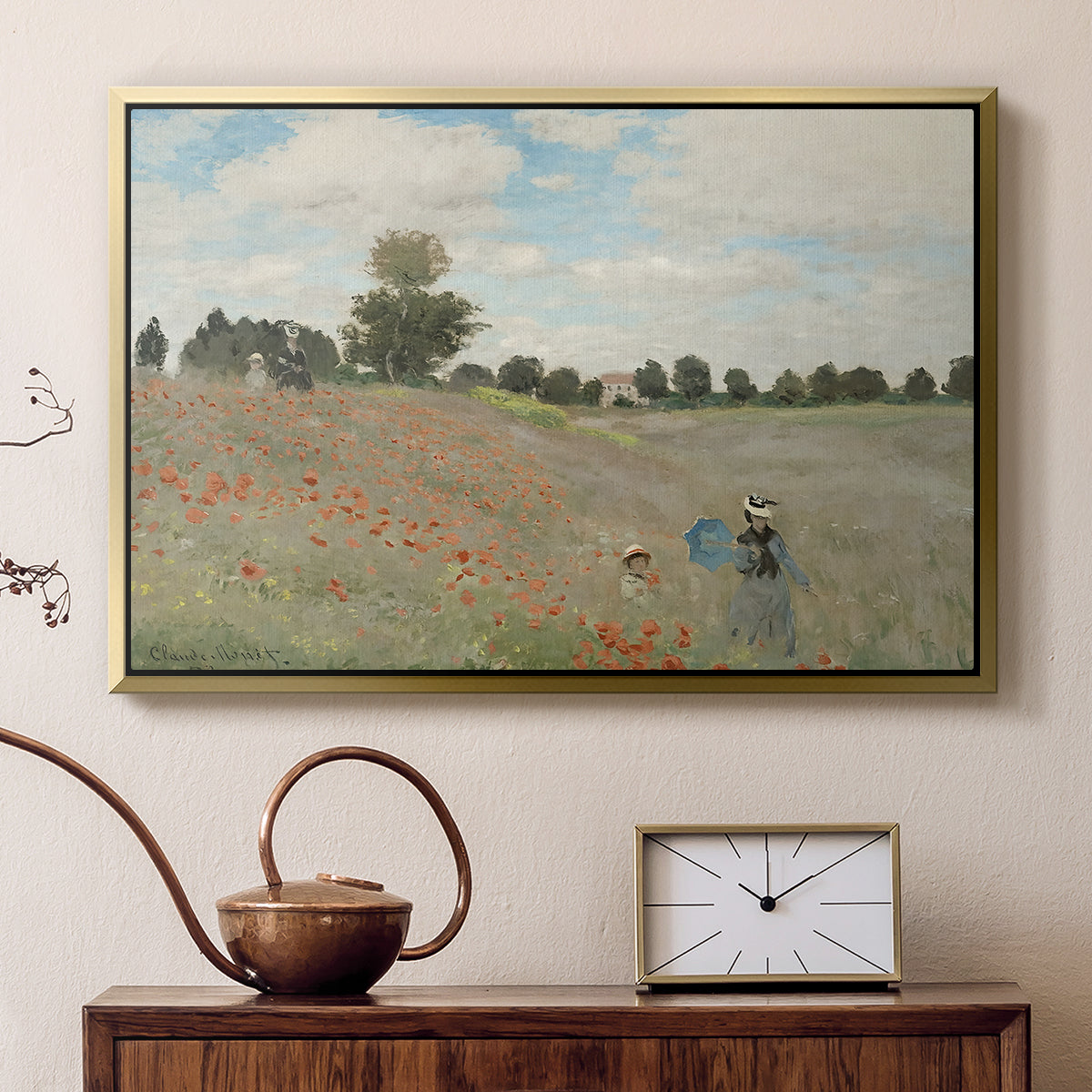 Gold floater framed canvas featuring a bright meadow filled with poppies under open sky, displayed above a cabinet in a soft-toned living room.