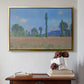 Gold floater framed canvas featuring Poppy Field (Giverny), 1890-1891 by Claude Monet above an entryway table in a minimalist foyer.
