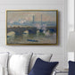 Waterloo Bridge, Gray Day, 1903 by Claude Monet displayed above a sofa in a living room in a gold floater frame, featuring an impressionist depiction of bridge with soft gray tones and haze.