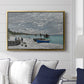 The Beach at Sainte-Adresse, 1867 by Claude Monet displayed above a sofa in a living room in a gold floater frame, featuring a lively beach scene with people overlooking water and ships.